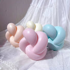 Square Knot Candle Mould 4 - Silicone Mould, Mold for DIY Candles. Created using candle making kit with cotton candle wicks and candle colour chips. Using soy wax for pillar candles. Sold by Myka Candles Moulds Australia