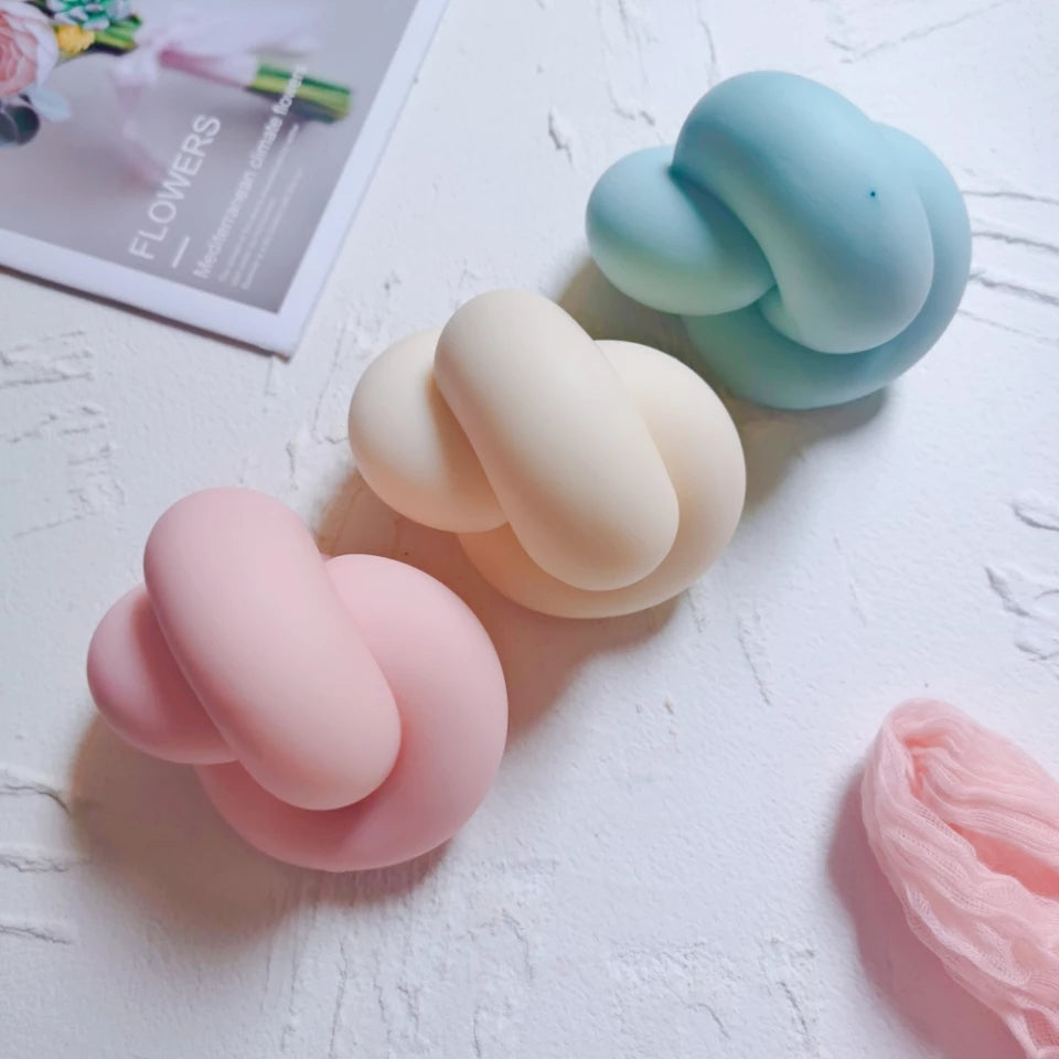 Infinity Knot Candle Mould 2 - Silicone Mould, Mold for DIY Candles. Created using candle making kit with cotton candle wicks and candle colour chips. Using soy wax for pillar candles. Sold by Myka Candles Moulds Australia