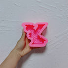An intricate Alphabet Silicone Candle Moulds silicone candle mold by MYKA Candles and Moulds, designed for aesthetic candles and resin moulds.