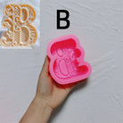 An aesthetic Alphabet Silicone Candle Moulds silicone candle mould from MYKA Candles and Moulds, perfect for soap, resin, and cake mould art.