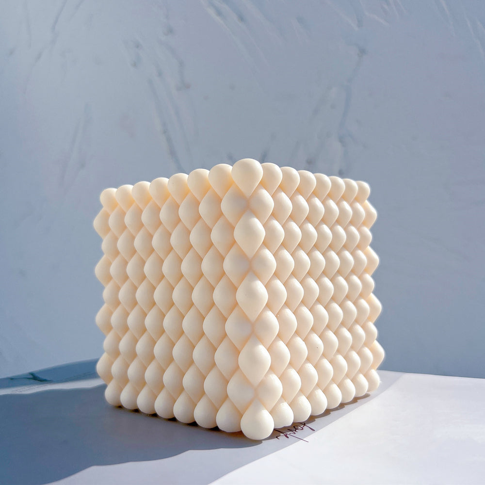 Close-up of the Braid Cube Candle Mould silicone candle mould by MYKA Candles and Moulds for soy wax, soap moulds, and baking mould hobbyists.