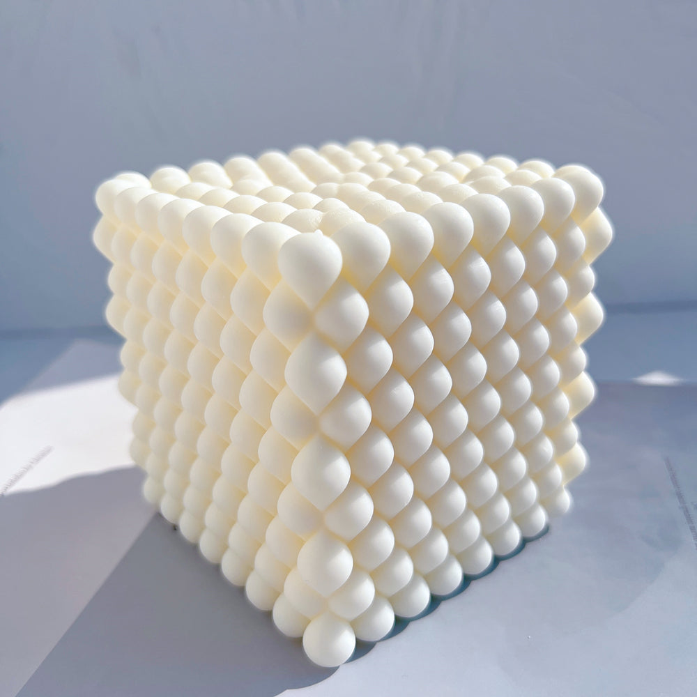An aesthetic Braid Cube Candle Mould silicone candle mould from MYKA Candles and Moulds, perfect for soap, resin, and cake mould art.