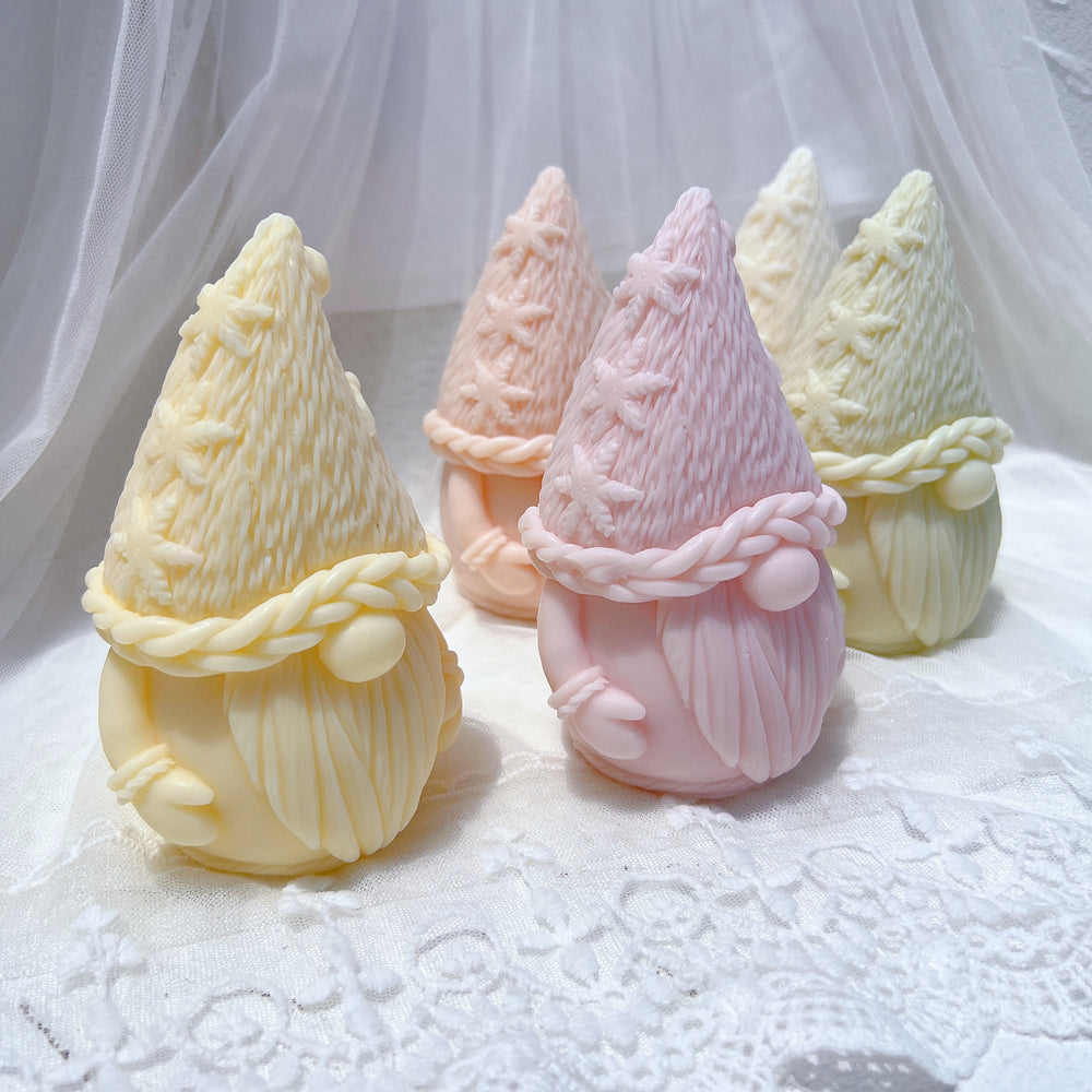 An aesthetic Christmas Gnome Candle Mould silicone candle mould from MYKA Candles and Moulds, perfect for soap, resin, and cake mould art.