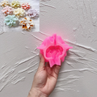 A heat-resistant Christmas Poinsettia Silicone Candle Mould silicone candle mould by MYKA Candles and Moulds, ideal for soap, resin, and baking mould applications.
