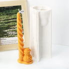 An intricate Christmas Twisted Pillar Silicone Candle Moulds silicone candle mold by MYKA Candles and Moulds, designed for aesthetic candles and resin moulds.