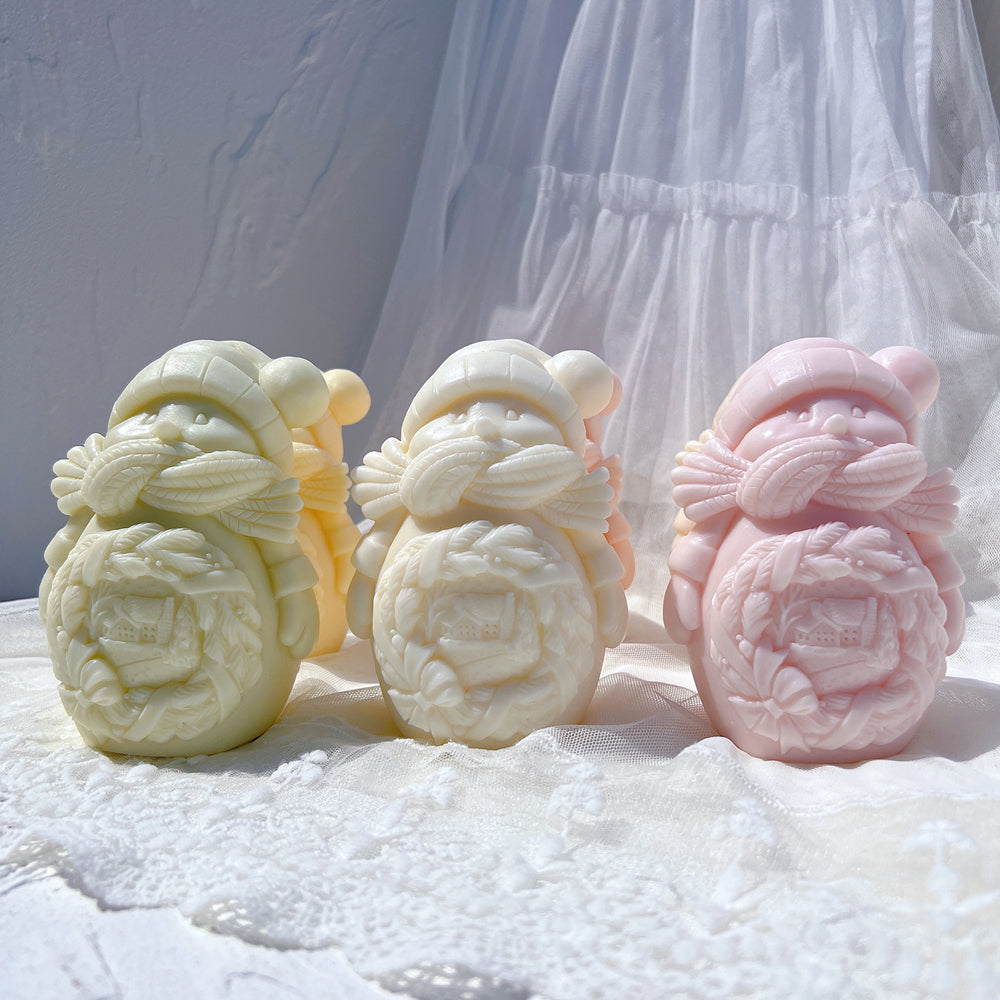 A premium Cozy Snowman Candle Mould silicone candle mold by MYKA Candles and Moulds, a versatile tool for soap, resin, and cake mould crafting.