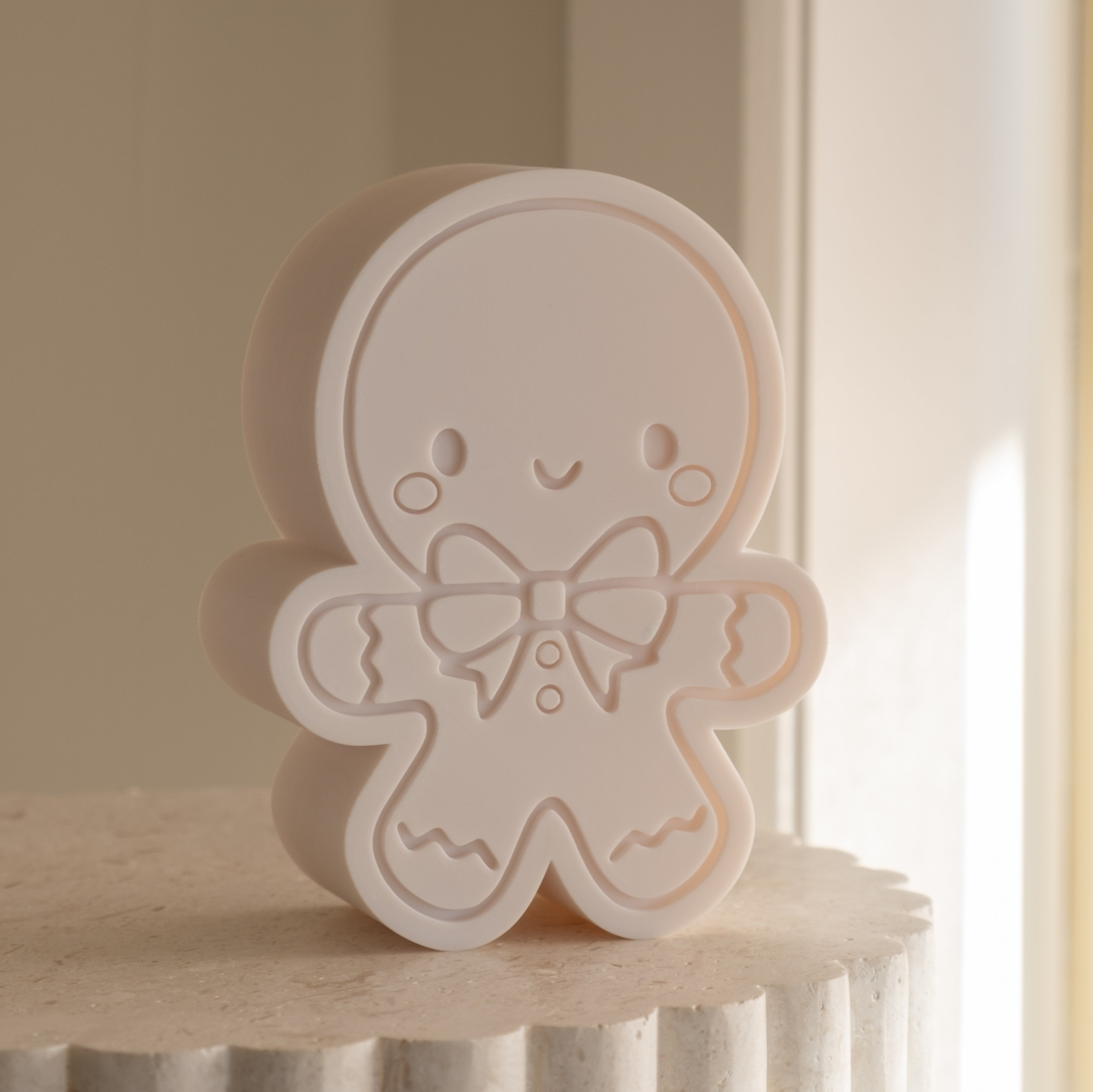 A Cute Gingerbread Man Candle Mould silicone candle mold by MYKA Candles and Moulds, the perfect multipurpose tool for soap, resin, and cake mould casting.