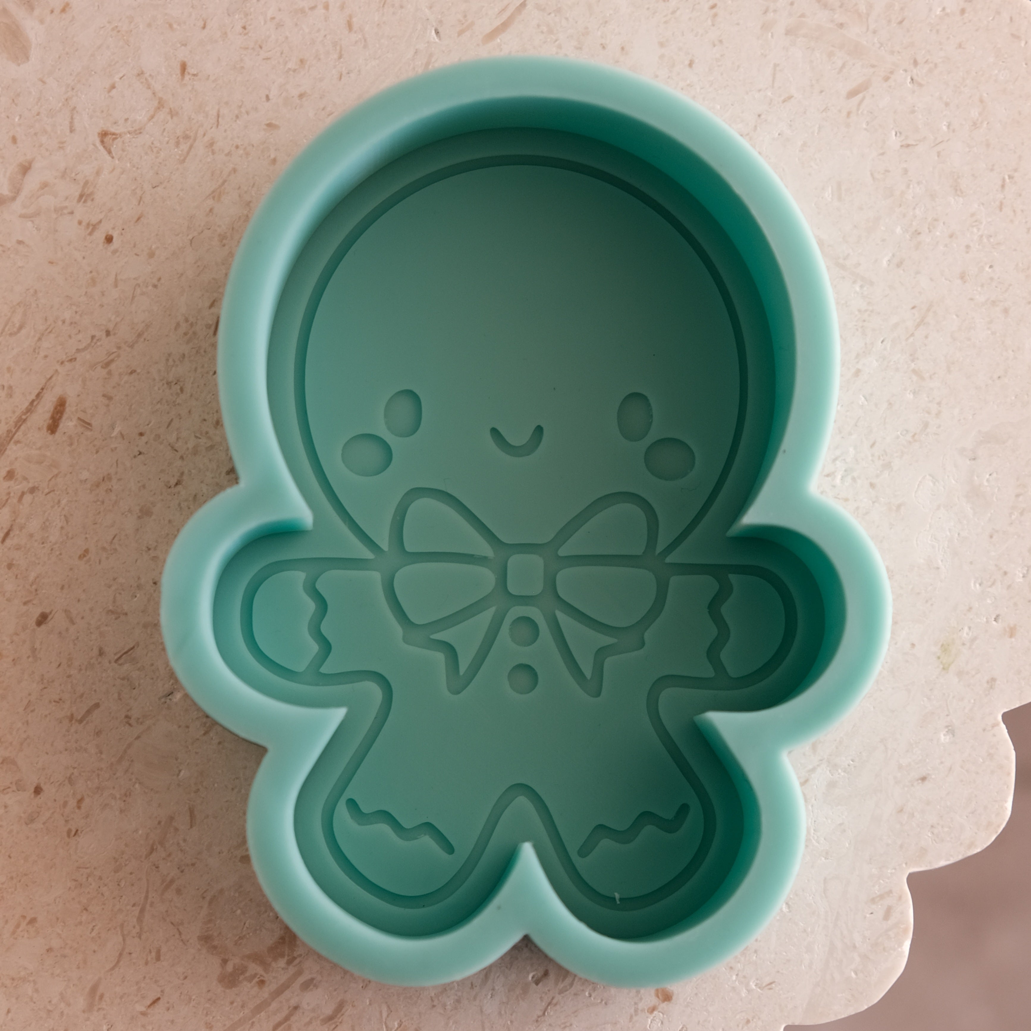 A high-performance Cute Gingerbread Man Candle Mould silicone candle mold from MYKA Candles and Moulds for resin art and professional baking mould use.