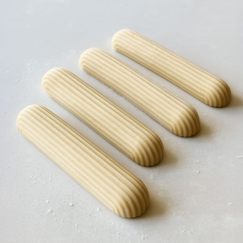 A detailed Eclair Silicone Candle Mould silicone candle mould by MYKA Candles and Moulds, perfect for candle making, soap moulds, and resin moulds.