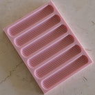 A detailed Eclair Silicone Candle Mould silicone candle mould by MYKA Candles and Moulds, perfect for candle making, soap moulds, and resin moulds.