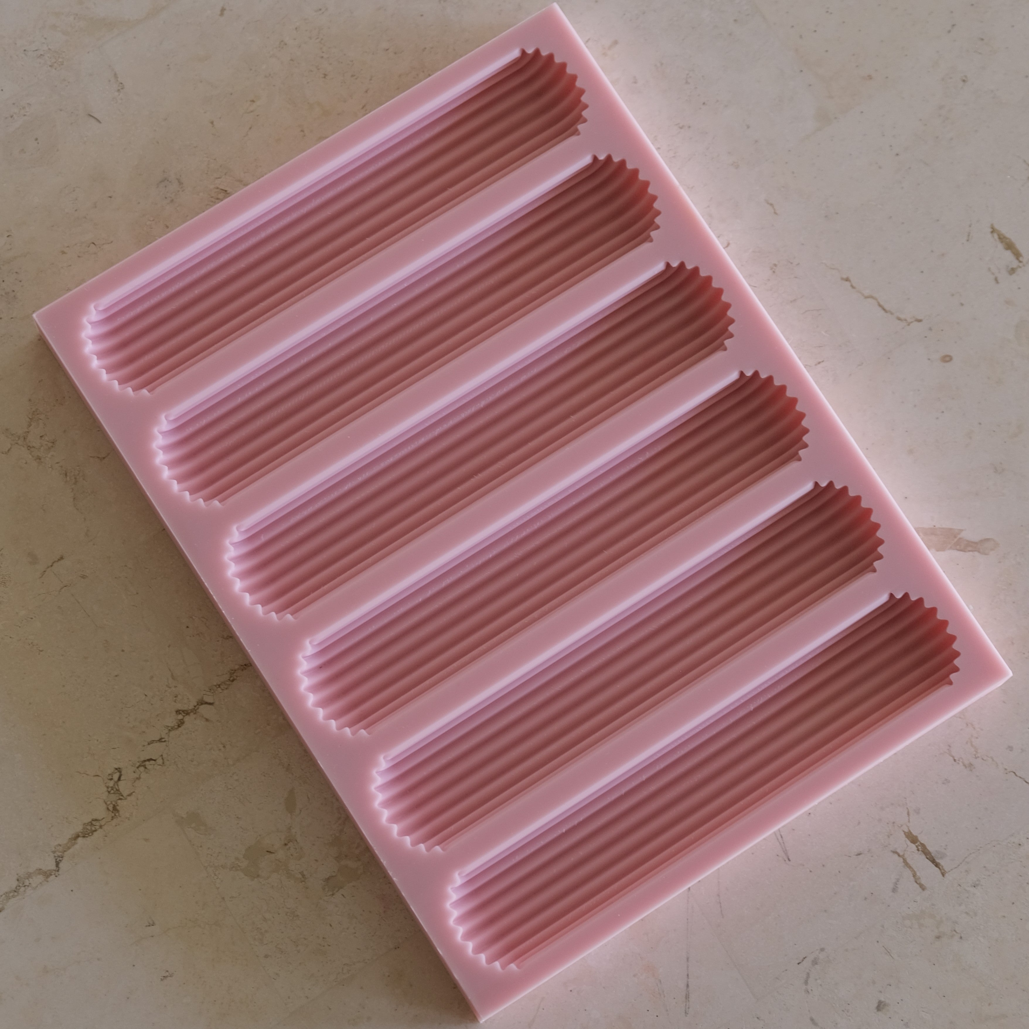 A detailed Eclair Silicone Candle Mould silicone candle mould by MYKA Candles and Moulds, perfect for candle making, soap moulds, and resin moulds.