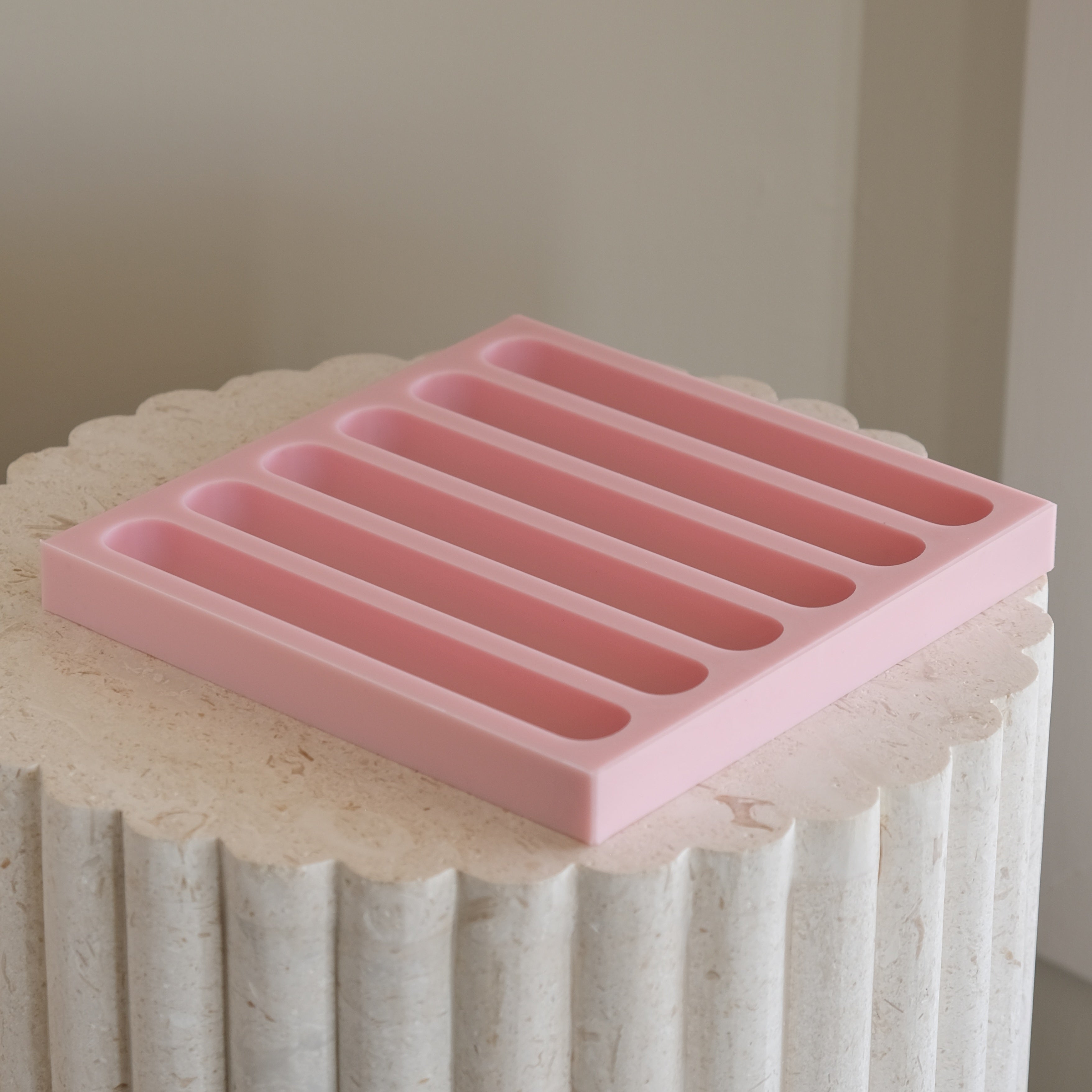A heat-resistant Eclair Silicone Candle Mould silicone candle mould by MYKA Candles and Moulds, ideal for soap, resin, and baking mould applications.