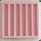 A heat-resistant Eclair Silicone Candle Mould silicone candle mould by MYKA Candles and Moulds, ideal for soap, resin, and baking mould applications.