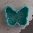 Close-up of the Floral Butterfly Candle Mould silicone candle mould by MYKA Candles and Moulds for soy wax, soap moulds, and baking mould hobbyists.