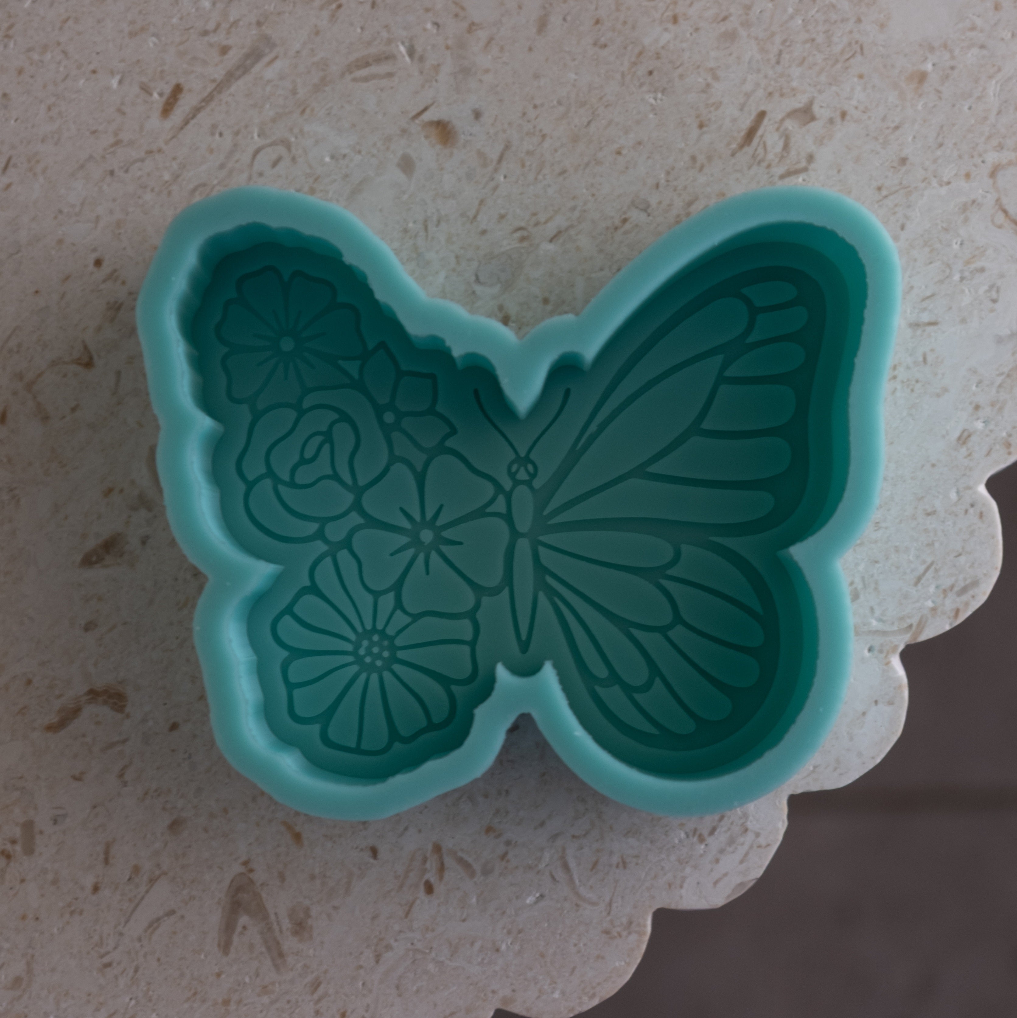 Close-up of the Floral Butterfly Candle Mould silicone candle mould by MYKA Candles and Moulds for soy wax, soap moulds, and baking mould hobbyists.