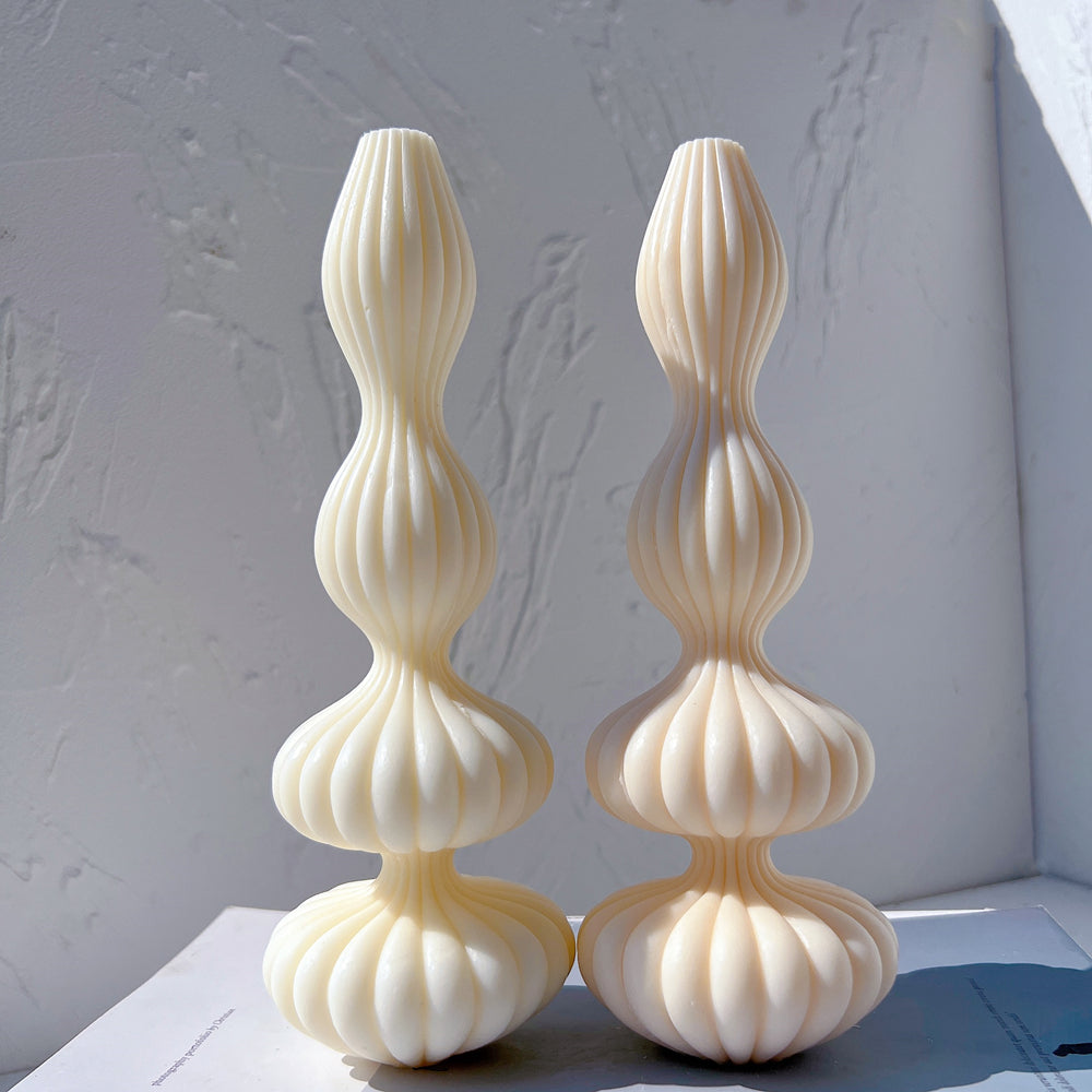 A versatile Fluidform Ribbed Vase Moulds silicone candle mould by MYKA Candles and Moulds, suitable for resin jars and concrete planter moulds.