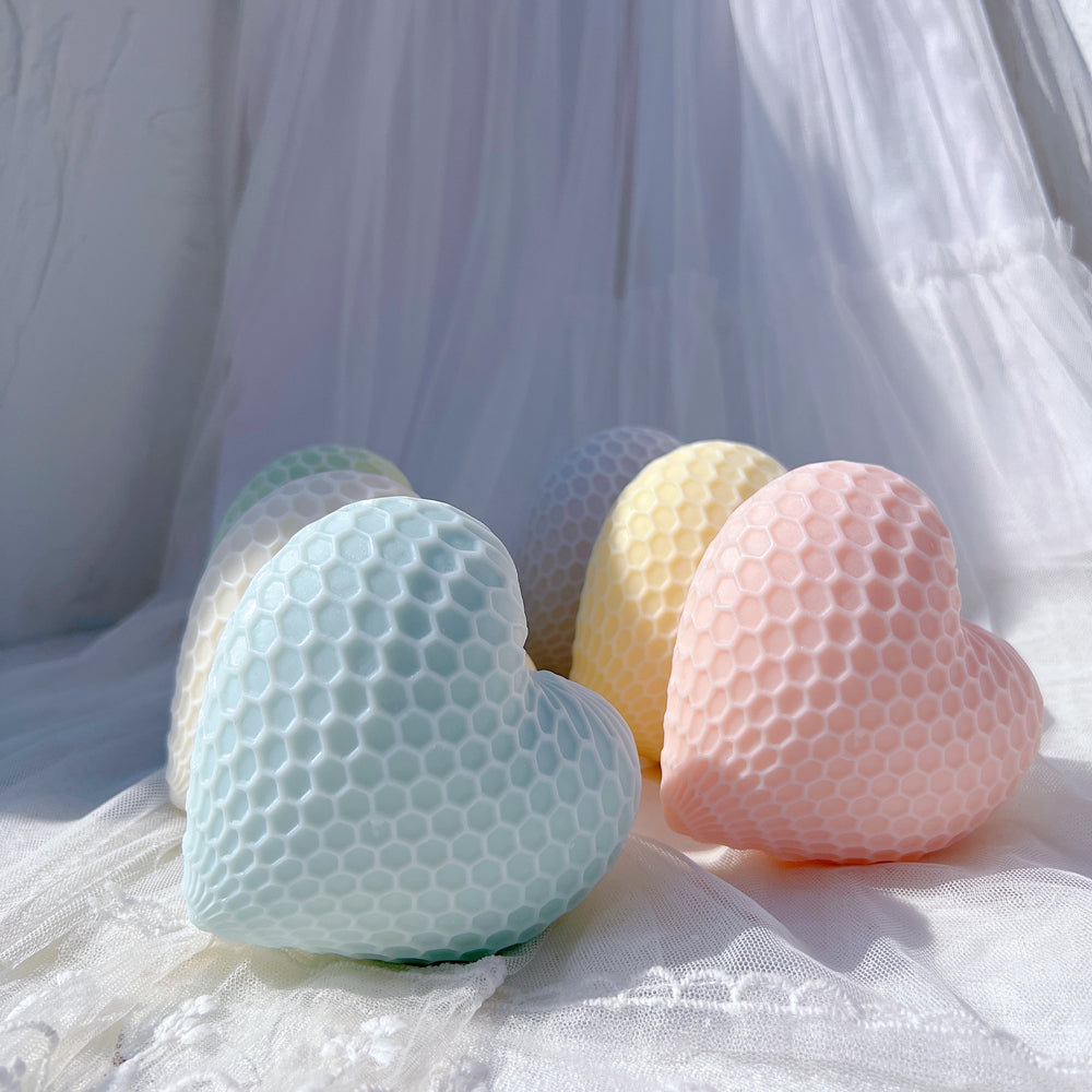 A Honeycomb Heart Candle Mould silicone candle mold by MYKA Candles and Moulds, the perfect multipurpose tool for soap, resin, and cake mould casting.