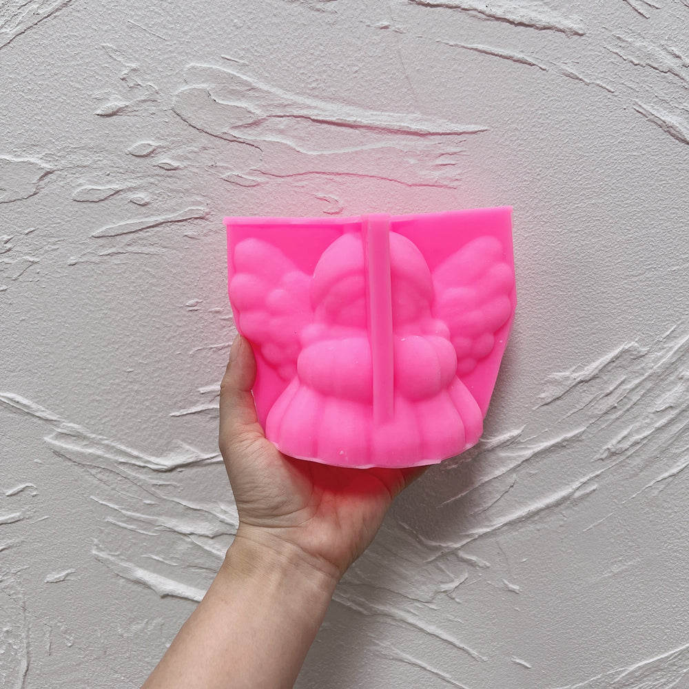 Showcasing the Knitted Angel Candle Mould silicone candle mould by MYKA Candles and Moulds for creative baking moulds and candle making.