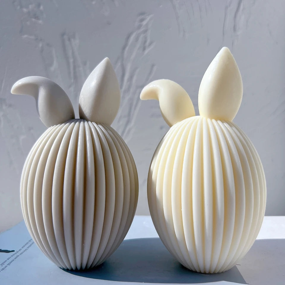 A Ribbed Bunny Egg Candle Moulds silicone candle mold by MYKA Candles and Moulds, designed for easy release in soap, resin, and cake mould casting.