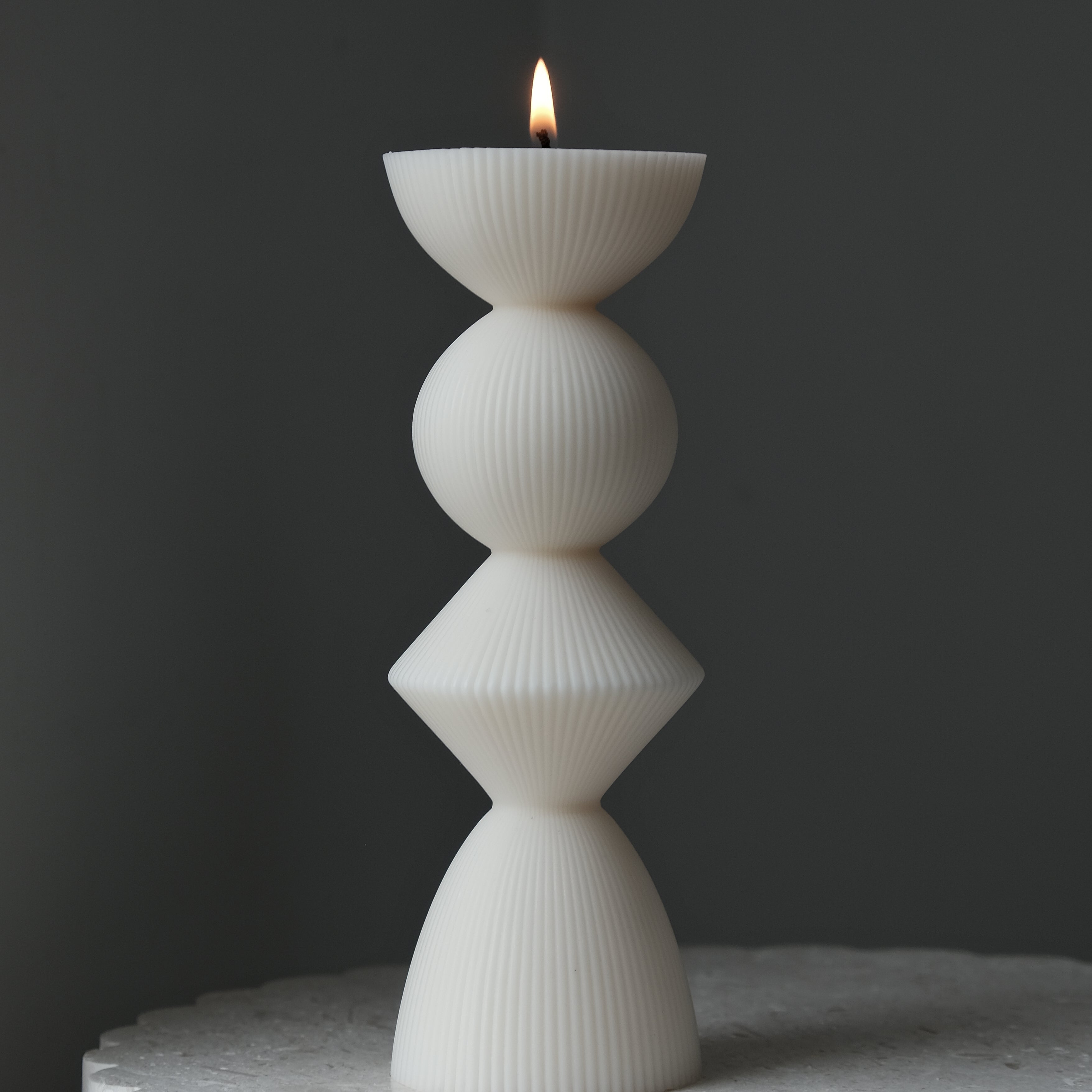 Showcasing the Ribbed Geometric Pillar Candle Mould silicone candle mould by MYKA Candles and Moulds for creative baking moulds and candle making.