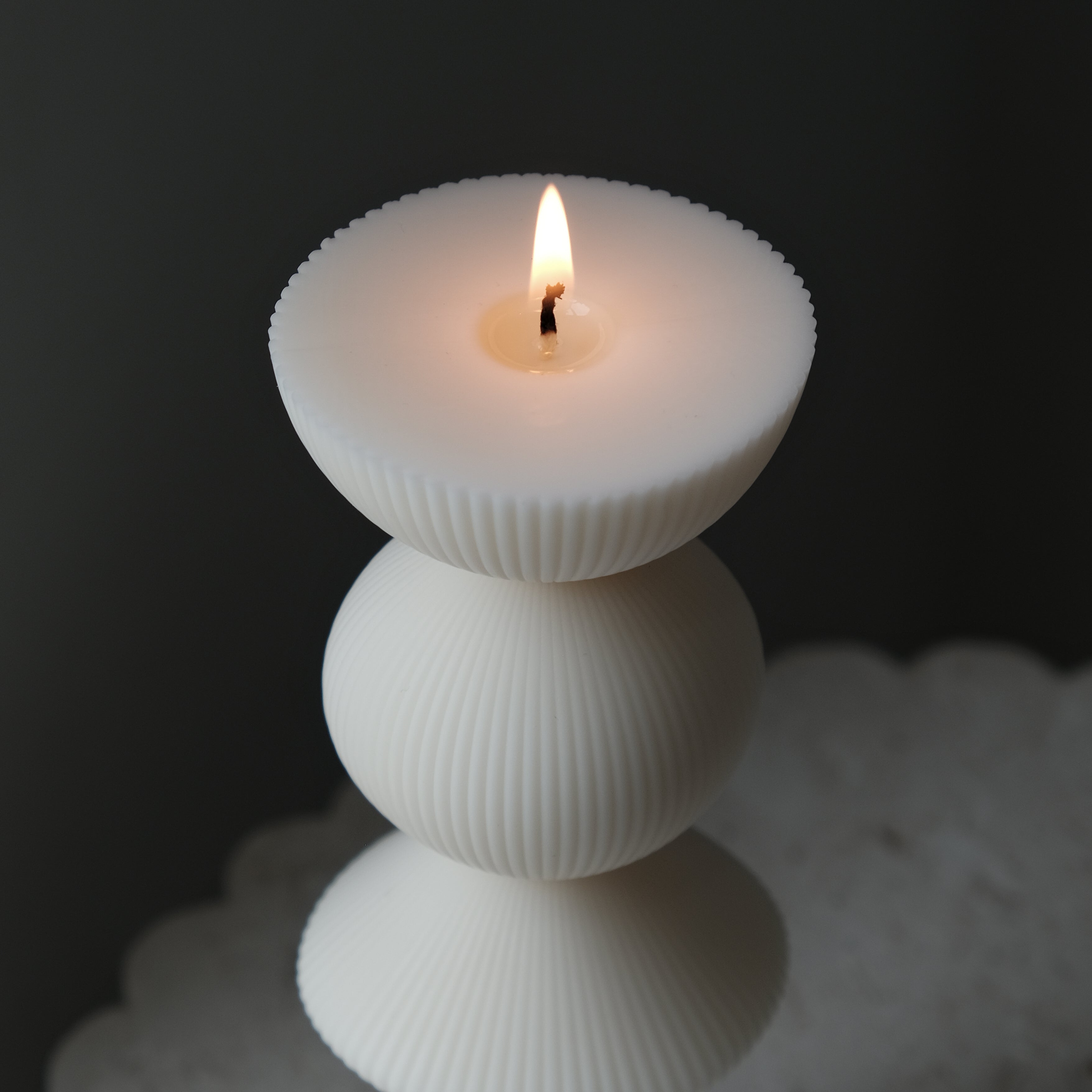 The flexible Ribbed Geometric Pillar Candle Mould silicone candle mould by MYKA Candles and Moulds, suitable for soap moulds and food-grade cake mould use.