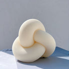 Precision-designed Ribbed Infinity Knot Candle Mould silicone candle mold by MYKA Candles and Moulds for resin moulds and gourmet cake mould designs.
