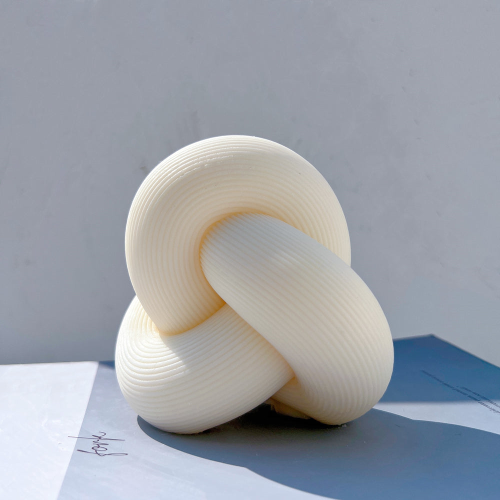 The Ribbed Infinity Knot Candle Mould silicone candle mould by MYKA Candles and Moulds, perfect for small business candle, soap, and cake mould production.