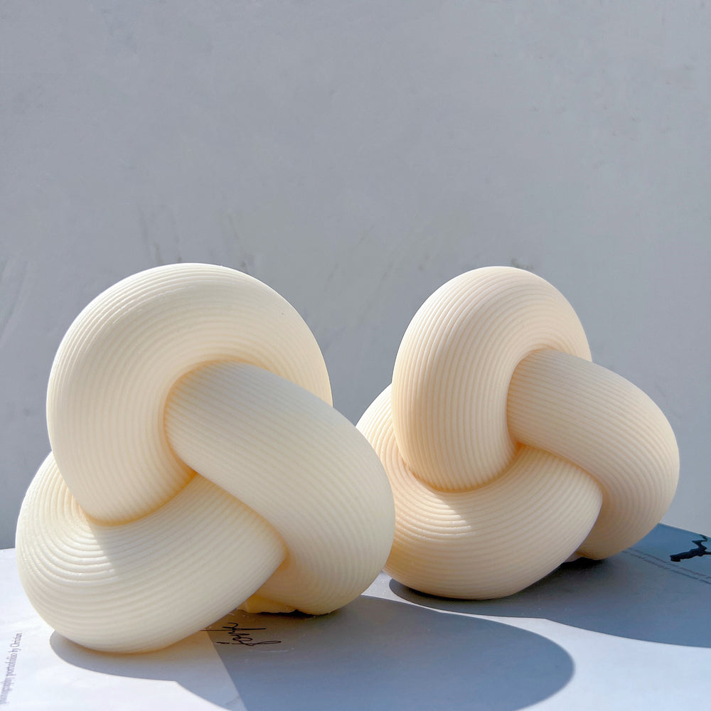 Handmade Ribbed Infinity Knot Candle Mould silicone candle mold from MYKA Candles and Moulds, perfect for resin moulds and unique baking mould shapes.
