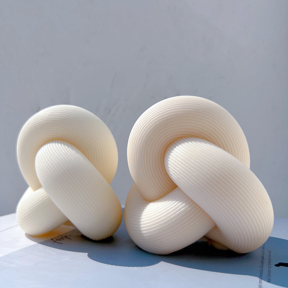 A high-performance Ribbed Infinity Knot Candle Mould silicone candle mold from MYKA Candles and Moulds for resin art and professional baking mould use.