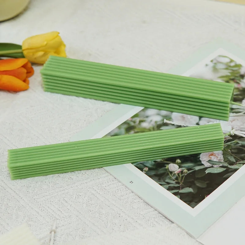 A Ribbed Rectangular Pillar Candle Moulds silicone candle mold by MYKA Candles and Moulds, designed for easy release in soap, resin, and cake mould casting.