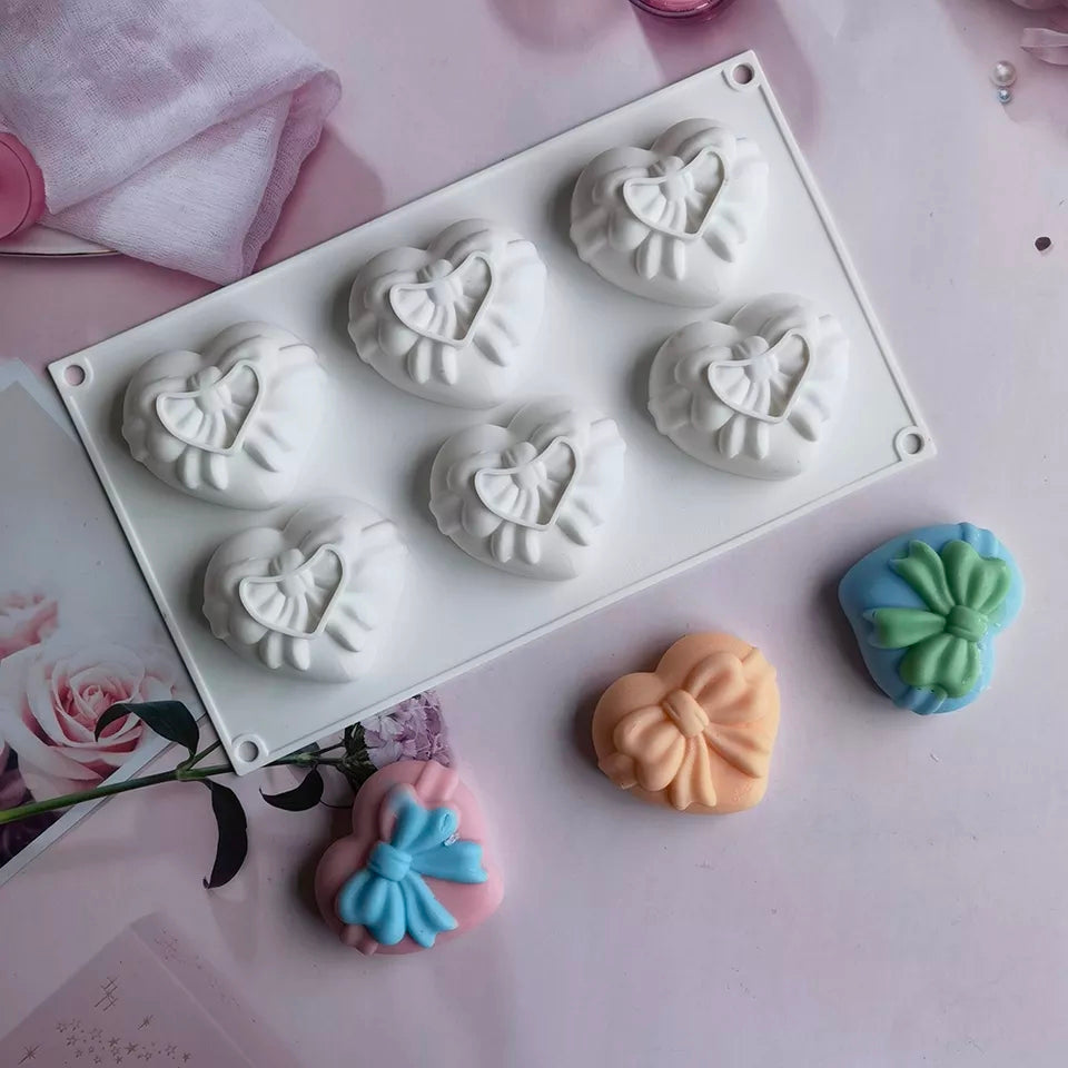 Bow Hearts Candle Mould - 6 Cavities 1 - Silicone Mould, Mold for DIY Candles. Created using candle making kit with cotton candle wicks and candle colour chips. Using soy wax for pillar candles. Sold by Myka Candles Moulds Australia