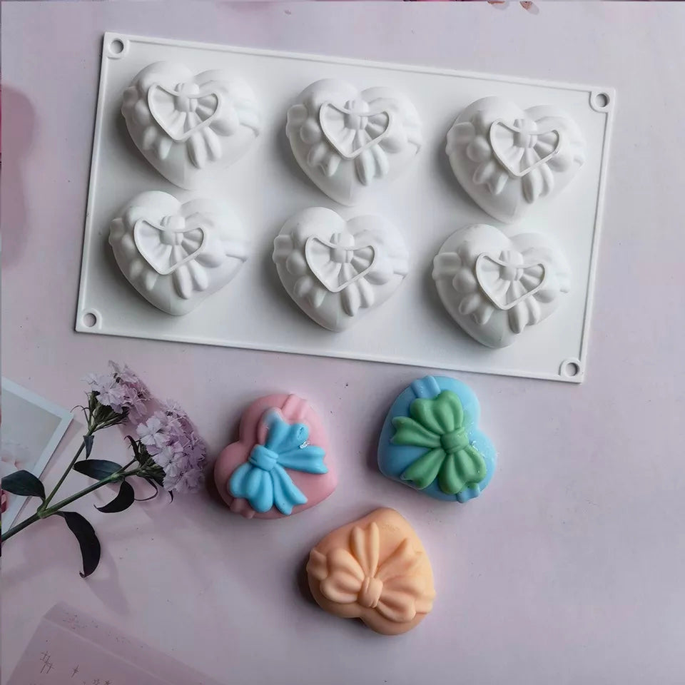 Bow Hearts Candle Mould - 6 Cavities 0 - Silicone Mould, Mold for DIY Candles. Created using candle making kit with cotton candle wicks and candle colour chips. Using soy wax for pillar candles. Sold by Myka Candles Moulds Australia