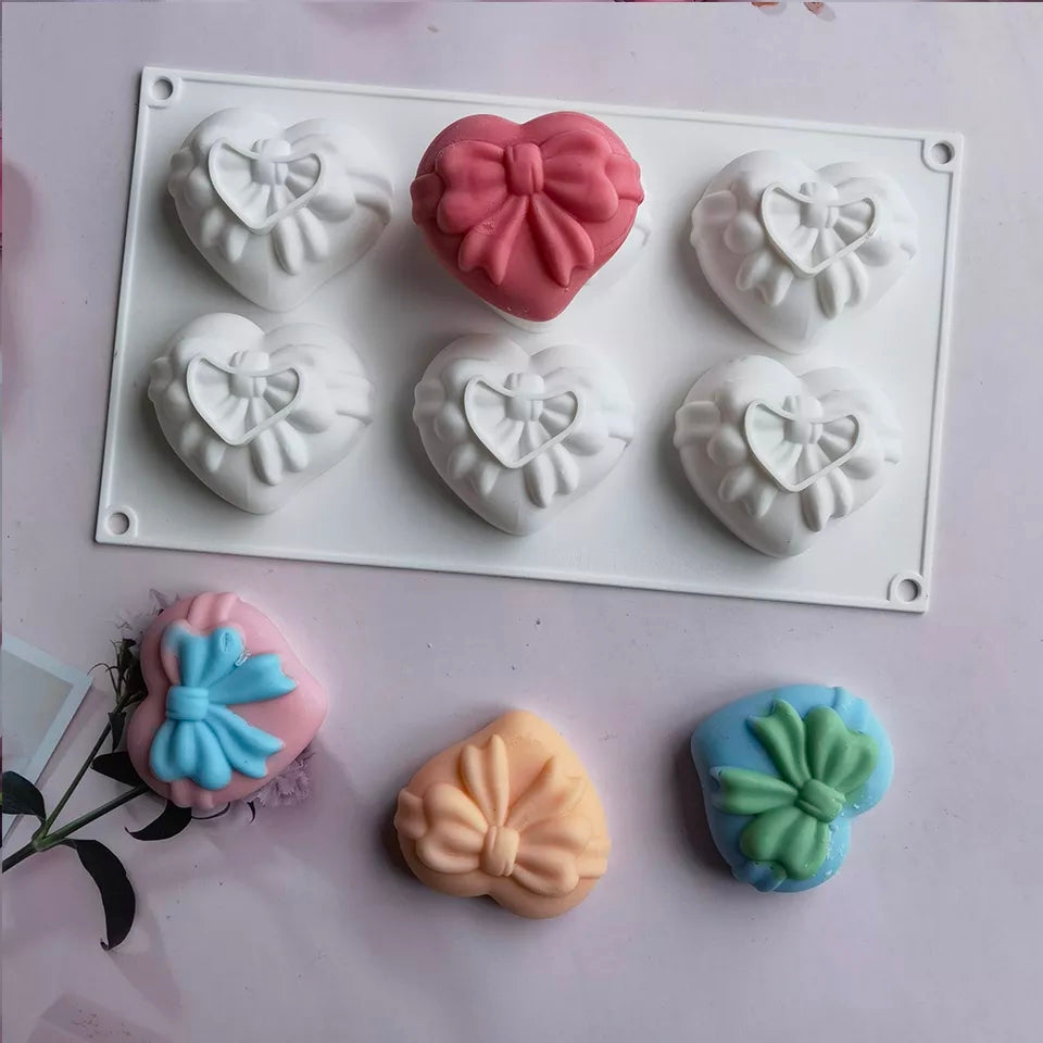 Bow Hearts Candle Mould - 6 Cavities 2 - Silicone Mould, Mold for DIY Candles. Created using candle making kit with cotton candle wicks and candle colour chips. Using soy wax for pillar candles. Sold by Myka Candles Moulds Australia