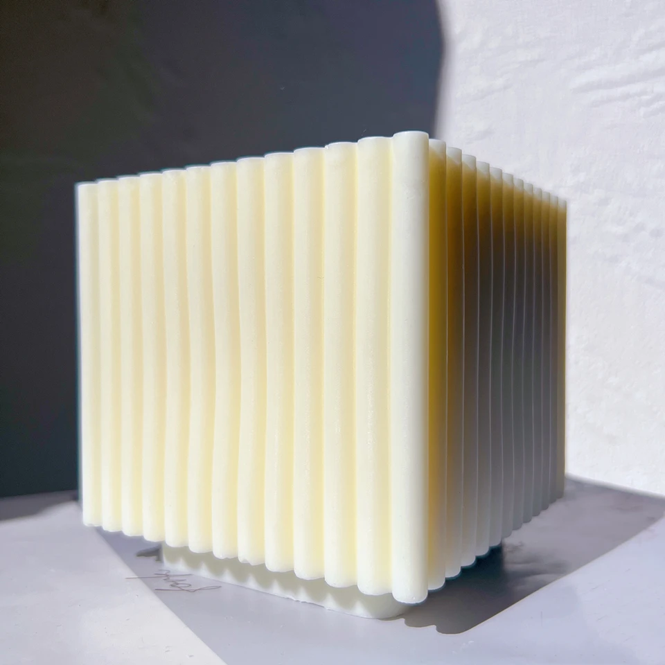 An aesthetic Ribbed Cube Candle Mould silicone candle mould from MYKA Candles and Moulds, perfect for soap, resin, and cake mould art.