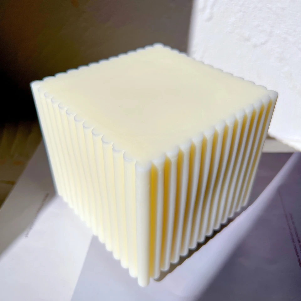 An intricate Ribbed Cube Candle Mould silicone candle mold by MYKA Candles and Moulds, designed for aesthetic candles and resin moulds.