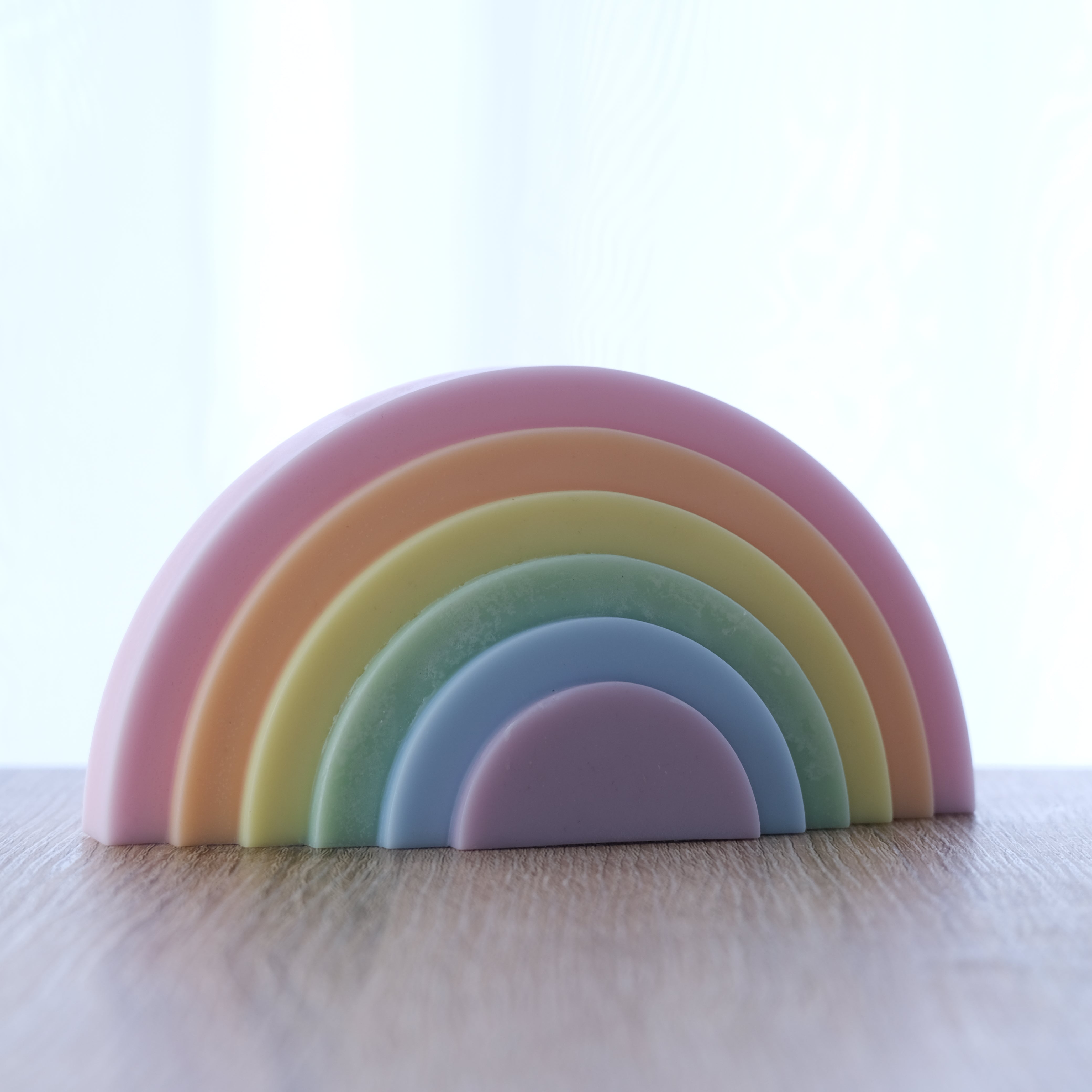 An intricate Tiered Rainbow Candle Mould silicone candle mold by MYKA Candles and Moulds, designed for aesthetic candles and resin moulds.